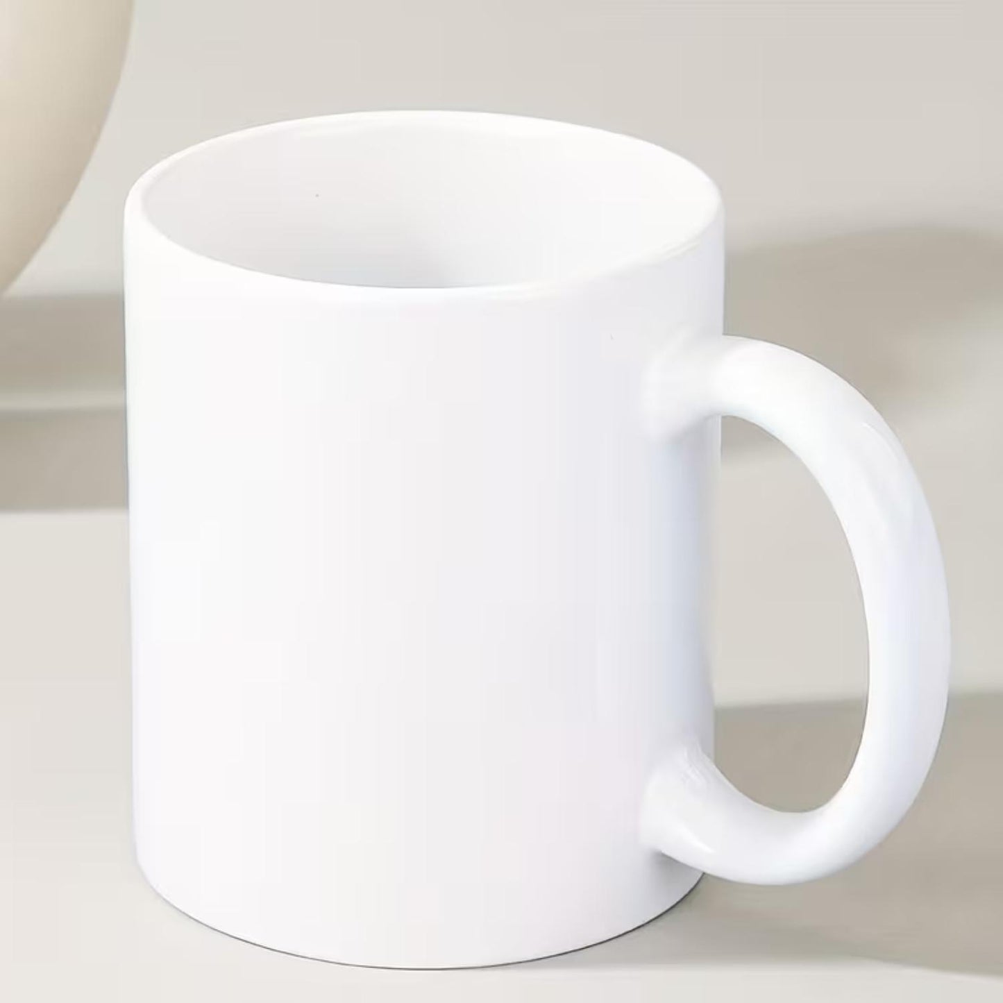 Blank ceramic cups, in black and white colors. Pure white plain cups. Suitable for DIY at home. For daily use in household and office settings.